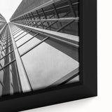Framed canvas featuring a close-up of a skyscraper in black with colorful, textured accents.