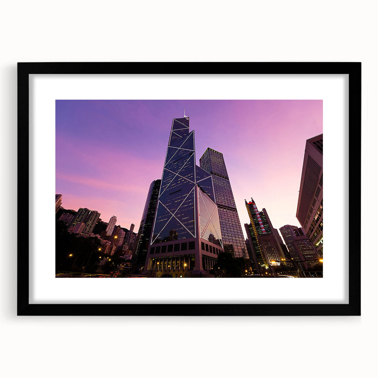 Extra large abstract art print of colorful, textured skyscrapers on a framed black mat, ideal for living room decor.