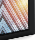 Extra large framed canvas of a black skyscraper design with colorful, textured accents, ideal for living room decor.