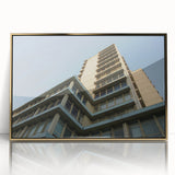 Mid-century modernist acrylic print of a skyscraper design in gold and black tones, ideal for modern art wall decor.