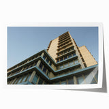 Rolled print of a skyscraper design in gray and metallic tones, suitable for modern dining room decor.