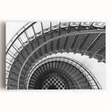 Black and white photograph of a spiral staircase on stretched canvas, ideal for kitchen wall art.