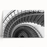 Black and white photo of a spiral staircase on stretched canvas, ideal for kitchen wall art or bedroom ambiance.