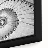 Close-up of a black framed canvas featuring a colorful, textured staircase design, ideal for living room decor.