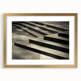Extra large abstract art print of a spiral staircase in muted gray tones on a framed canvas, ideal for living room decor.