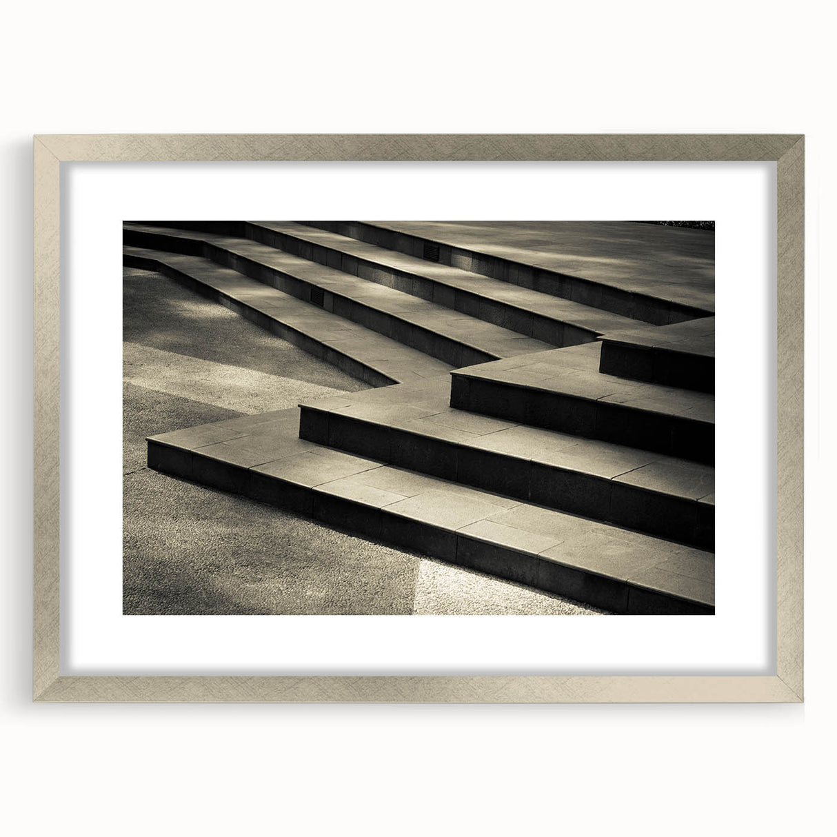 Textured art print of an abstract staircase in muted gray, ideal for modern bedroom decor, framed with a silver mat.