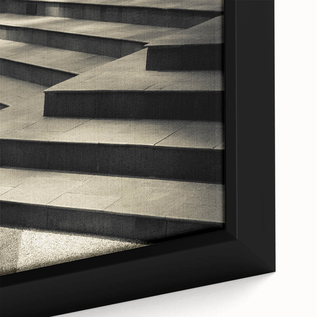 Close-up of a black wall art featuring a colorful, textured staircase design on a framed canvas, ideal for living room decor.