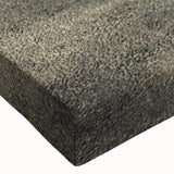 Close-up of a large art piece featuring a black and white spiral staircase on stretched canvas.