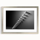 Textured art print of an abstract staircase in muted gray, ideal for modern bedroom decor, framed with a silver mat.