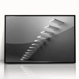 Large abstract wall art of a spiral staircase in black and white, framed acrylic, ideal for modern art wall decor.