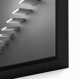 Close-up of a black textured staircase design on framed canvas, featuring colorful art accents.