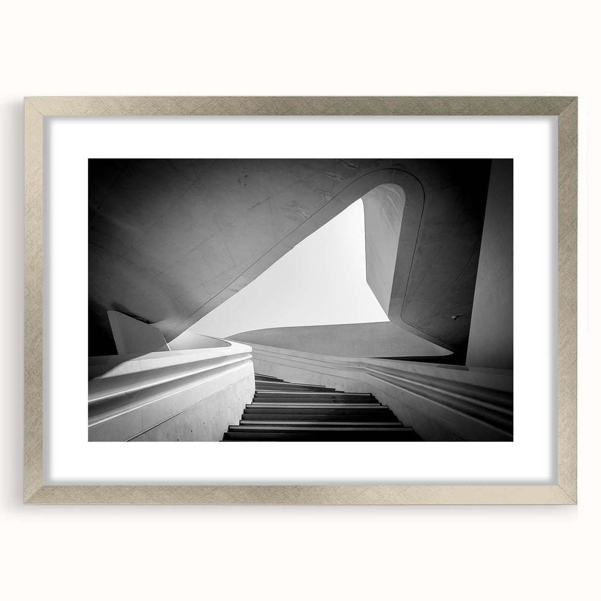 Textured abstract art print featuring a spiral staircase in muted grays, framed in silver, ideal for modern bedroom decor.