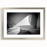 Textured abstract art print featuring a spiral staircase in muted grays, framed in silver, ideal for modern bedroom decor.
