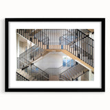 Abstract art print featuring a colorful, textured staircase design on a large black-framed canvas.