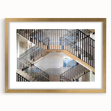 Extra large abstract art print featuring a textured spiral staircase design in gold and black tones, framed with mat.