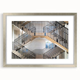 Textured art depicting an abstract staircase design in silver and gray tones on a framed print, suitable for bedroom decor.