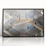 Large abstract wall art featuring a spiral staircase in black and white, acrylic print in a black frame.