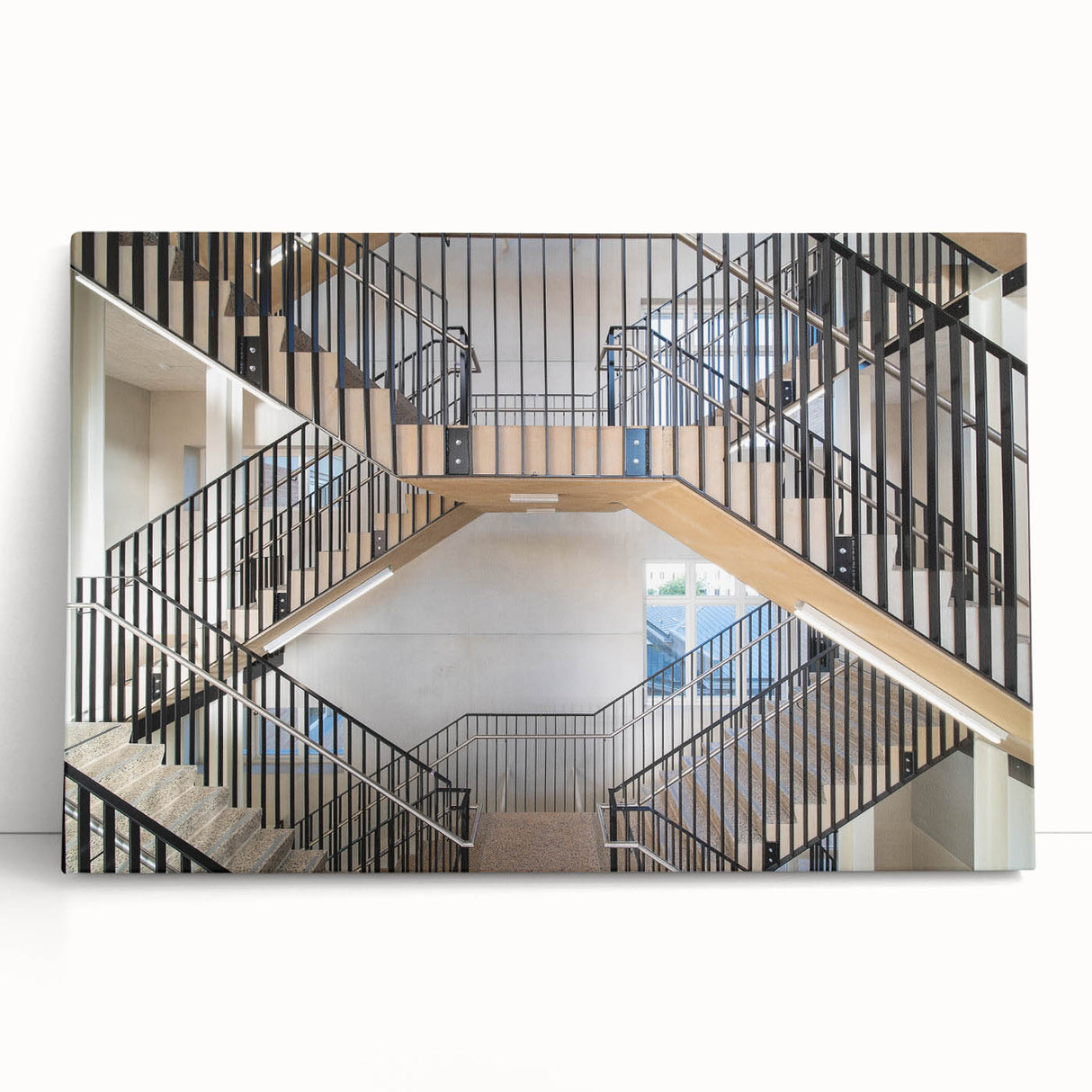 Black and white photograph of a spiral staircase on a stretched canvas, suitable as kitchen wall art or bedroom decor.