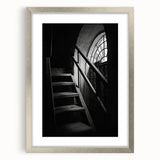 Abstract textured art print of a spiral staircase in muted gray tones, displayed in a silver frame.