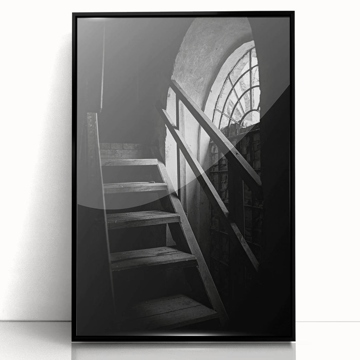 Large abstract wall art featuring a spiral staircase in black and white, framed in acrylic.