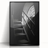 Large abstract wall art featuring a spiral staircase in black and white, framed in acrylic.