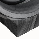 Close-up of a black and white large art piece depicting a spiraling staircase on stretched canvas.