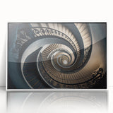 Art Deco poster featuring a spiral staircase in monochrome tones, presented in a white acrylic frame.