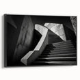 Black and white framed canvas of a spiral staircase, in a vintage poster art style, suitable for bedroom wall decor.