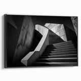 Black and white framed canvas of a spiral staircase, in a vintage poster art style, suitable for bedroom wall decor.