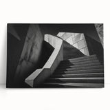 Black and white photograph of a spiral staircase on stretched canvas, ideal for kitchen wall art or bedroom ambiance.