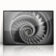 Large abstract wall art featuring a spiral staircase design in black and white, framed acrylic.