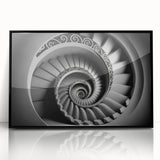 Large abstract wall art featuring a spiral staircase design in black and white, framed acrylic.