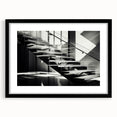Extra large abstract art print featuring a colorful, textured depiction of a spiral staircase on a black framed canvas.