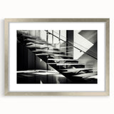 Textured art of an abstract spiral staircase in muted gray tones, framed in silver, ideal for modern bedroom decor.