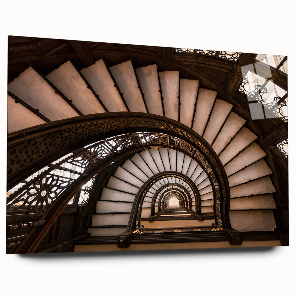 Large abstract wall art of a spiral staircase in monochrome, printed on acrylic glass.