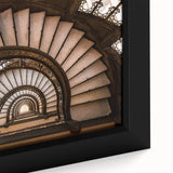 Close-up of a black wall art featuring a spiral staircase design on a framed canvas, ideal for living room decor.