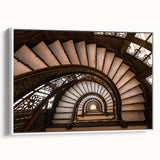 Vintage poster art of a spiral staircase in black and white on a framed canvas, ideal for living room decor.