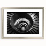 Textured art print of an abstract staircase in grayscale, framed in silver, ideal for modern bedroom decor.