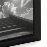 Close-up of a black wall art featuring a colorful, textured staircase design on a framed canvas, ideal for living room decor.