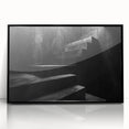 Large abstract wall art featuring a spiral staircase design in black and white tones, acrylic print framed in black.