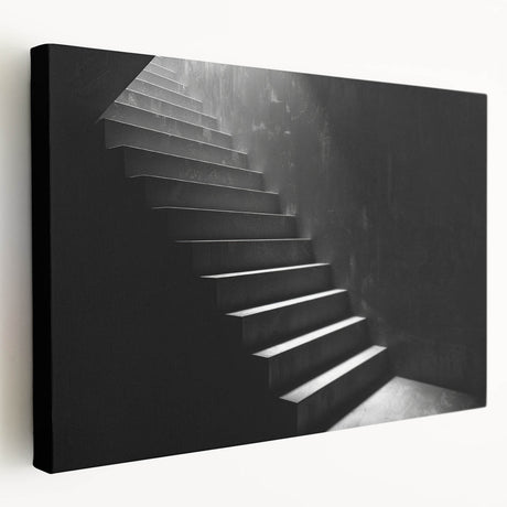 Side view of a large art print depicting a spiral staircase in monochrome tones on stretched canvas.