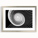 Textured art depicting an abstract staircase design in muted gray tones on a framed silver mat, suitable for bedroom decor.