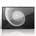 Large abstract wall art featuring a spiral staircase in black and white, acrylic print in a black frame.