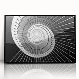 Large abstract wall art featuring a spiral staircase in black and white, acrylic print in a black frame.