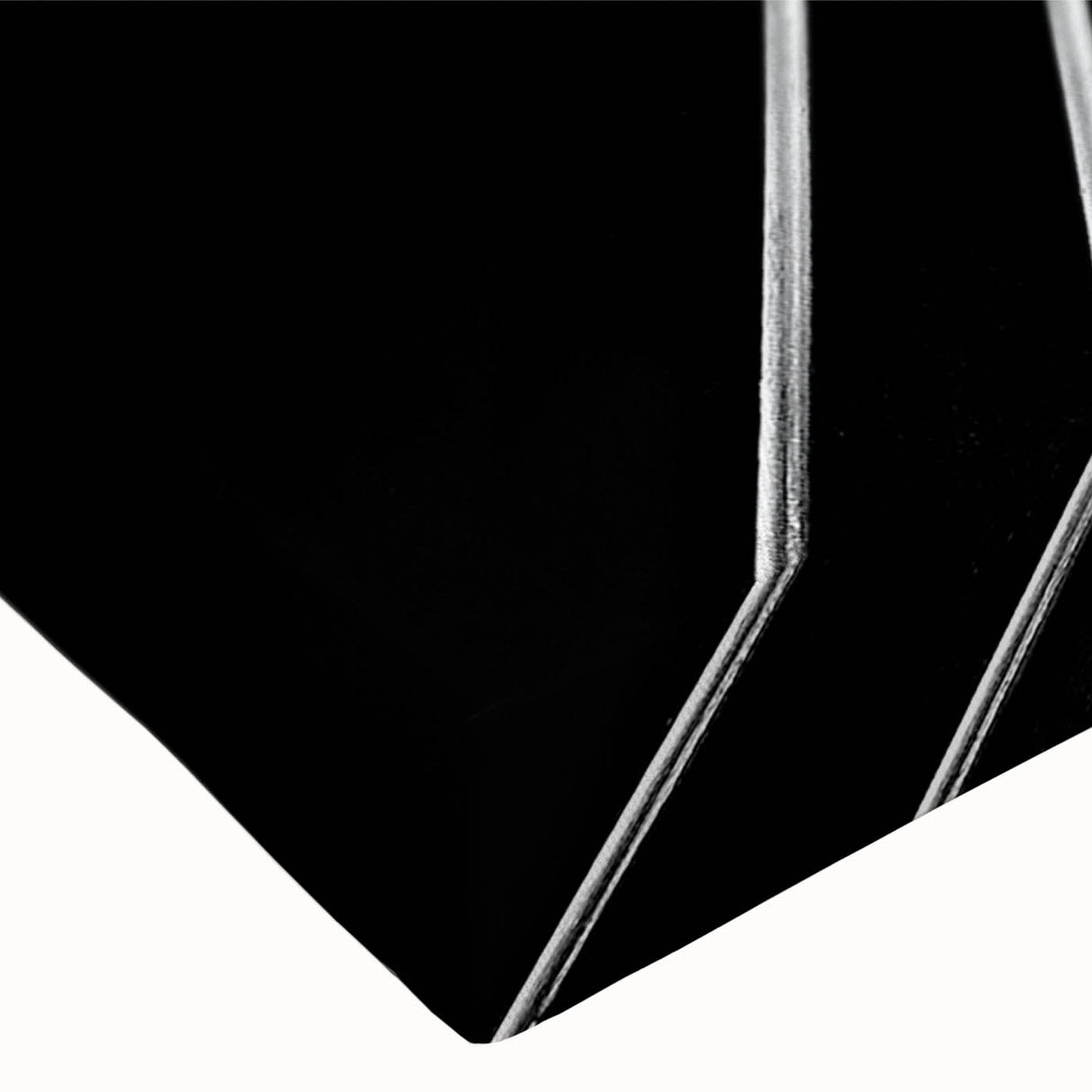 Black and white photo of a spiral staircase on stretched canvas, ideal for bedroom wall art.