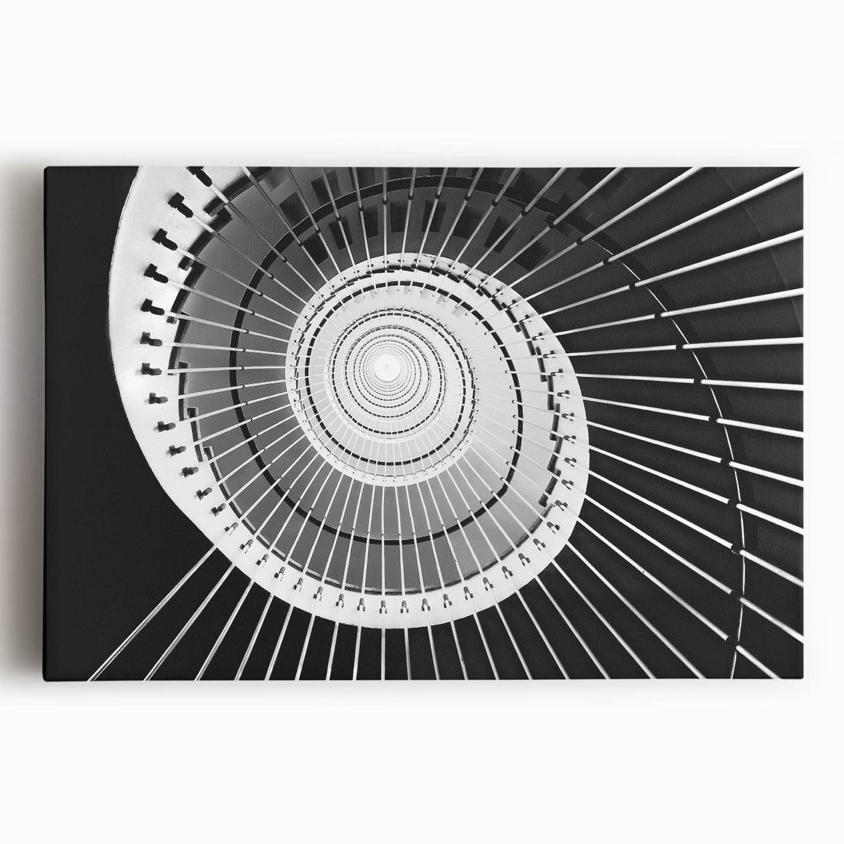 Black and white photo of a spiral staircase on stretched canvas, ideal for kitchen wall art.