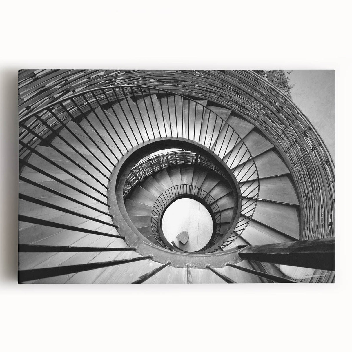 Black and white photograph of a spiral staircase on stretched canvas, ideal for kitchen wall art or bedroom ambiance.