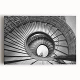 Black and white photograph of a spiral staircase on stretched canvas, ideal for kitchen wall art or bedroom ambiance.
