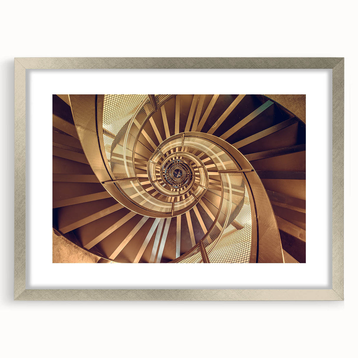 Textured abstract art print of a spiral staircase in muted gray, mounted in a silver frame, ideal for bedroom decor.
