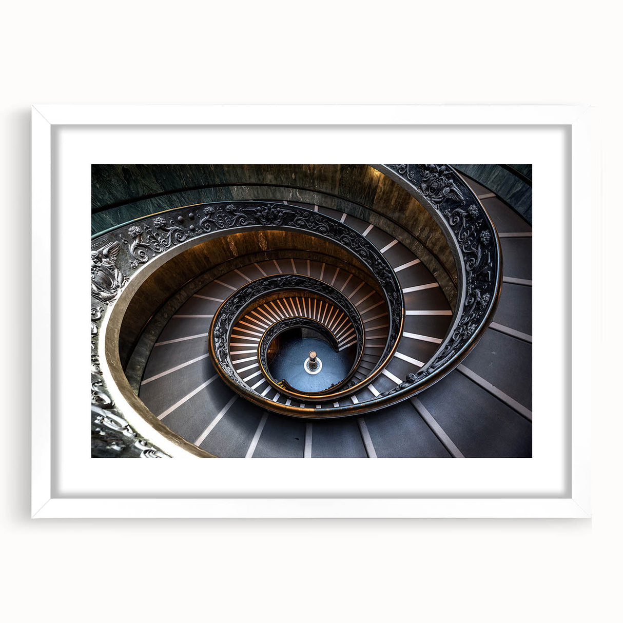 Abstract art print of a spiraling staircase in monochrome, framed with a white mat.